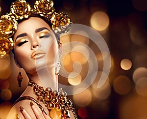 Golden holiday makeup. Fashion art hairstyle, manicure and makeup
