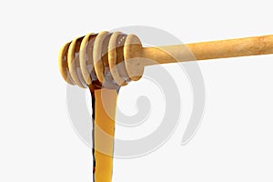 Golden honey drop from honey dipper, 3d rendering