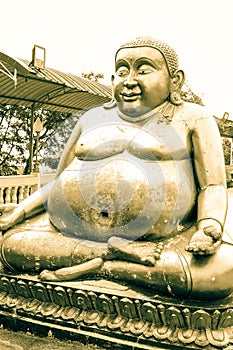 Golden Hotei Statue in Asia photo