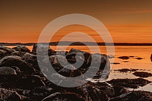 Golden hour over the rocky coast during sunset at Ytre Hvaler National Park in Norway