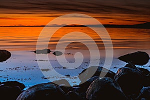 Golden hour over the rocky coast during sunset at Ytre Hvaler National Park in Norway