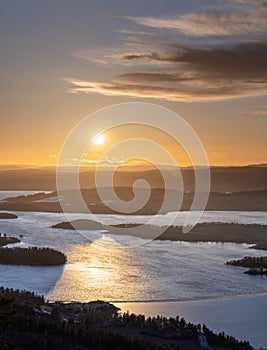 Golden hour over Steinsfjorden, a branch of Lake Tyrifjorden located in Buskerud, Norway. View from Kongens Utsikt Royal View at photo