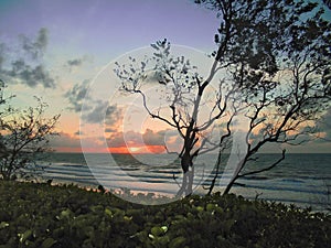 Sunset of peaceful and enchanting beauty at Dripstone beach. Darwin Northern Territory, Australia