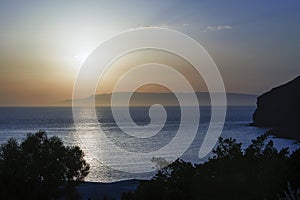 Golden hour sunset in the magical island of Patmos, Greece over a seascape and a horizon in summer time