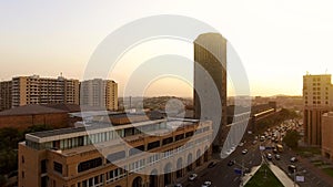 Golden hour in Yerevan, aerial view on vehicles moving near City Hall, cityscape