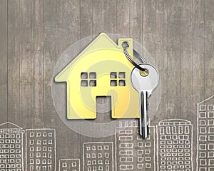 Golden house with key on wooden background, 3D rendering