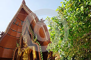 Golden huge Buddha statue is located on the top of the mountain in Thailand