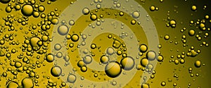 Golden Hyaluron Oil bubbles collagen serum or yellow oil bubbles drop texture background