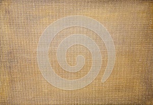 Golden imprimatura painted with oil paints on white primed canvas as background photo