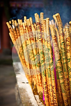 Golden incense sticks in chinese temple