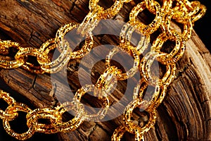 Golden jewel chain over a black background