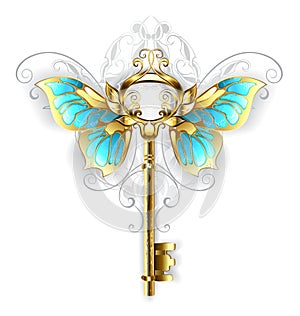 Golden key with butterfly wings