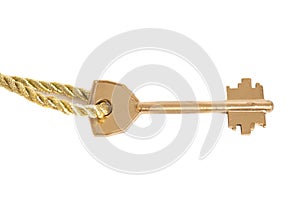 Golden key hanging on gold chain