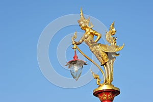 Golden Kinnaree lamp on electricity