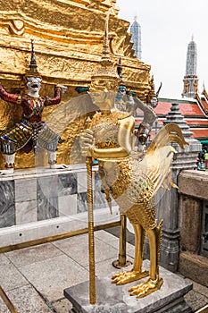 Golden Kinnari statue at temple,Wat Phra Kaew in Grand Palace