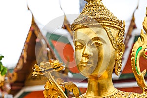 Golden Kinnari statue at Wat Phra Kaew