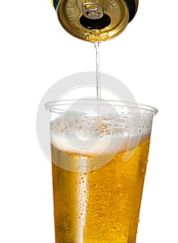 Golden lager or beer in disposable plastic cup