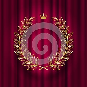 Golden laurel wreath with royal crown against a red curtain background.