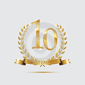 Golden laurel wreaths with ribbons and tenth anniversary year symbol on light background. 10 anniversary golden symbol