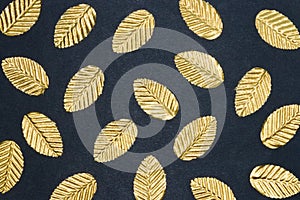 golden leaf rain on black background, creative art fall