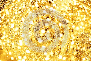 The golden LED light bokeh blurred abstract pattern background