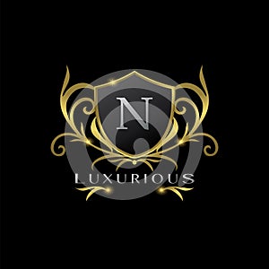 Golden Letter N Luxurious Shield Logo, vector design concept for luxuries business identity