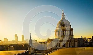 Golden light on the rooftops and dome of St. Paul`s Cathedral, L