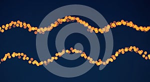 Golden Lights in Wavy Patterns Against a Dark Blue Background