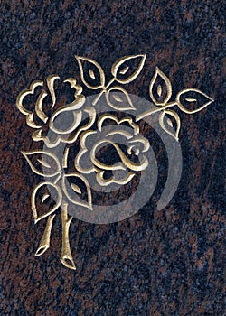 Golden line art holy rose symbol on red granite stone. A traditional emblem for the heavenly rose.