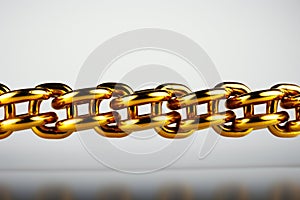 Golden link binds chain, isolated on white background