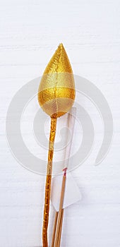 Golden lotus or water lily with incense and gold foil paper for worshiping Buddha isolate on white wall