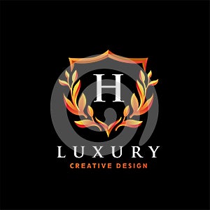 Golden Luxury Initial Letter H Logo Design Template with Shield and Floral Vintage