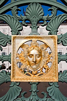 Golden mask on fence - Royal Palace - Turin Italy