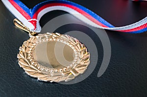 Golden medal for first place on black background