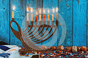 Golden menorah with flaming candles in the Chanukah