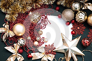 Golden Merry Christmas and Happy New Year Decoration. Red and gold Bauble on Christmas black background. Winter time