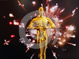 Hollywood Golden Oscar Academy award statue on blue sky background with copy space. Success and victory concept.