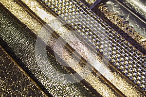 Golden and metallic tooled leather samples texture background