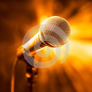 Golden microphone on stage