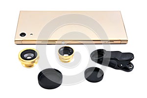 Golden mobile phone with zoom lens, clip and cover isolated on white background. Gold smart phone with lens isolated