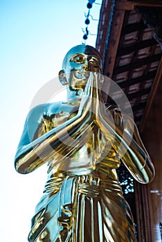 Golden monk statue at Thai temple