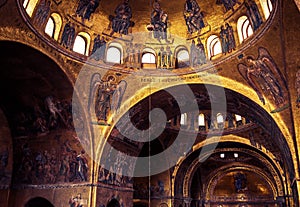 Golden mosaic interior of old St Mark`s Basilica or San Marco, it is top landmark of Venice. Luxury decorations inside Saint Mark`