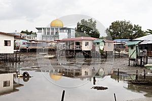 Golden Mosque Dome Above Poor Poverty Village Disrepair Run Down photo