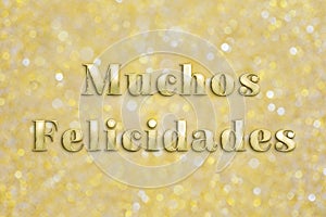 Golden `Muchos Felicidades` text on festive background photo