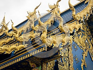 Golden Nagas Walking on The Roof