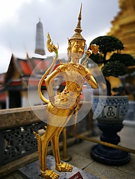 Golden Narasimha figure at grand palace Thailand