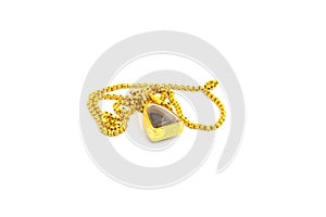 A golden necklace with amulet isolated on white background.