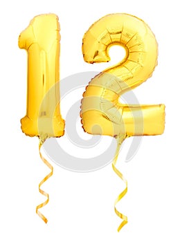 Golden number 12 twelve made of inflatable balloon with golden ribbon on white