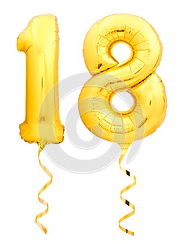 Golden number 18 eighteen made of inflatable balloon with ribbon isolated on white