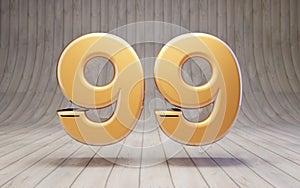 Golden number 99 on wooden floor
